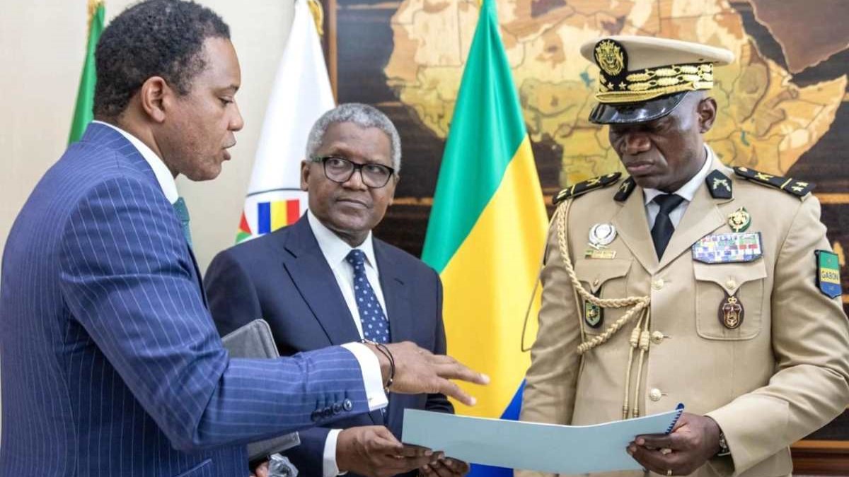 Dangote Group CEO (middle) during an audience with Gabon's transitional president (far right)