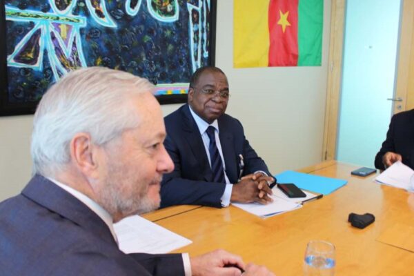 Cameroonian Finance Minister Louis Paul Motaze (middle) with investors