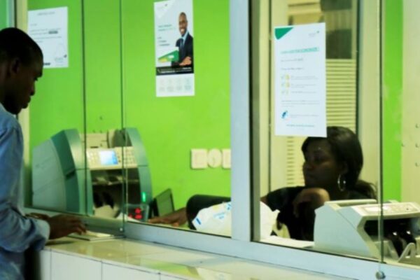 A customer at the checkout of a microfinance institution